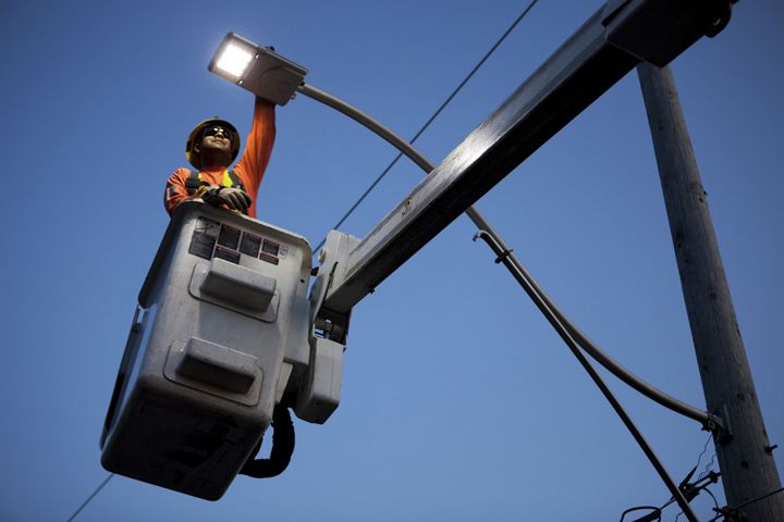 A Toronto Hydro employee installs LED lights on Delaware Street in Toronto, Canada. Delaware Street is home to an LED pilot project whereby Toronto Hydro is testing LED lights in residential neighborhoods.